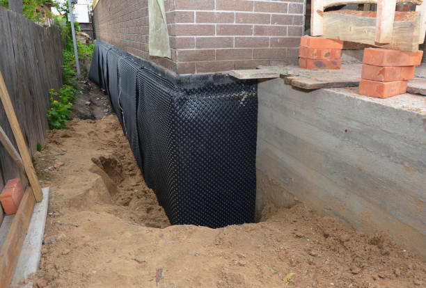 Happy homeowners after waterproofing job in Weyauwega